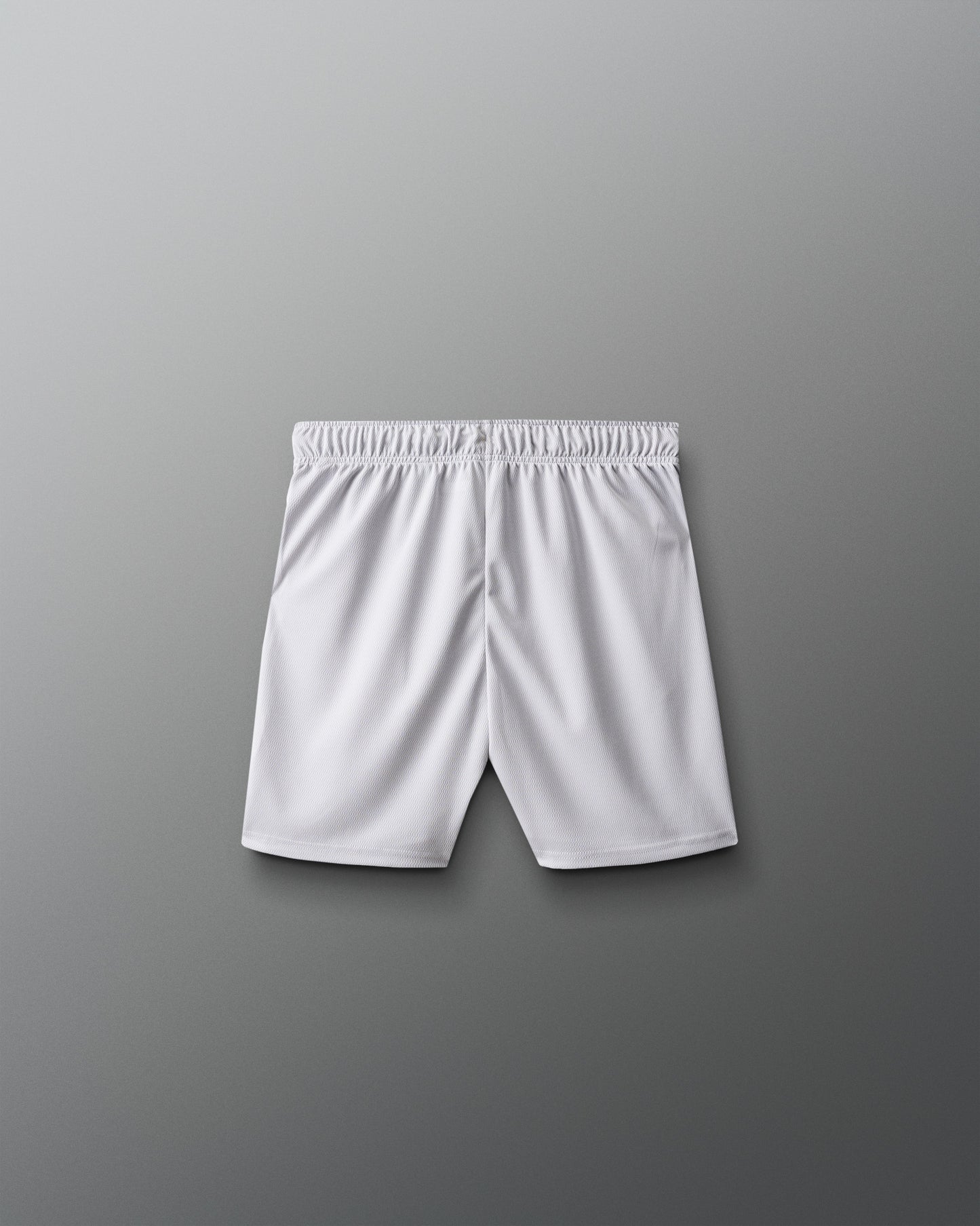 White athletic shorts on a gray background