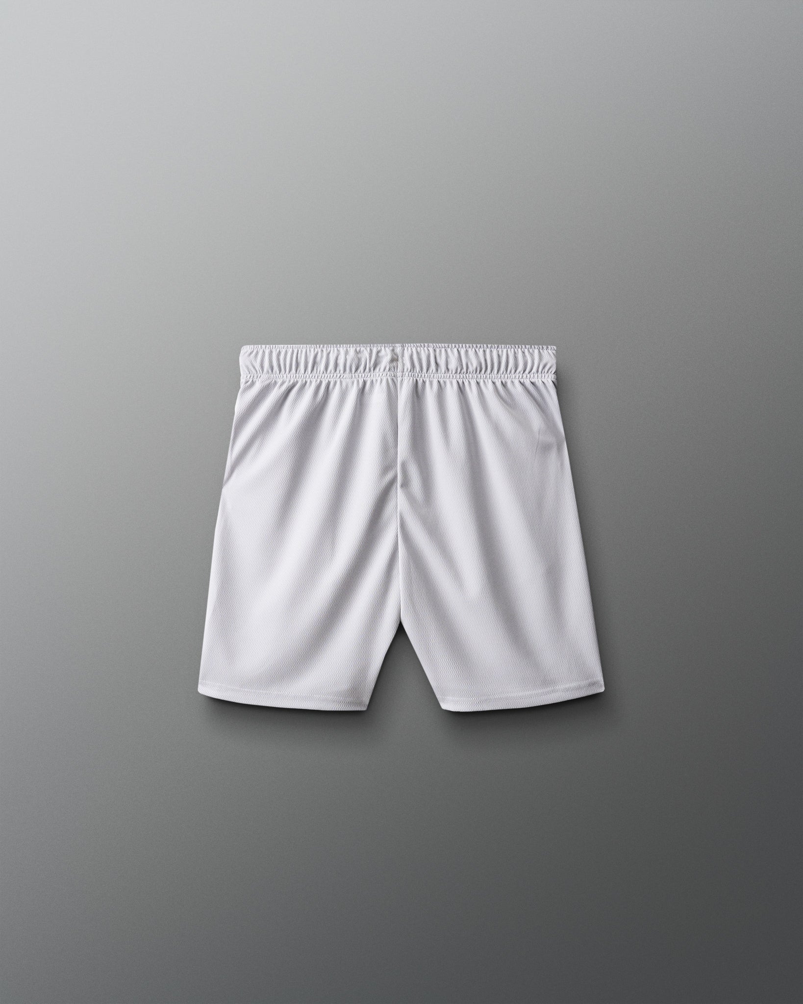 White athletic shorts on a gray background
