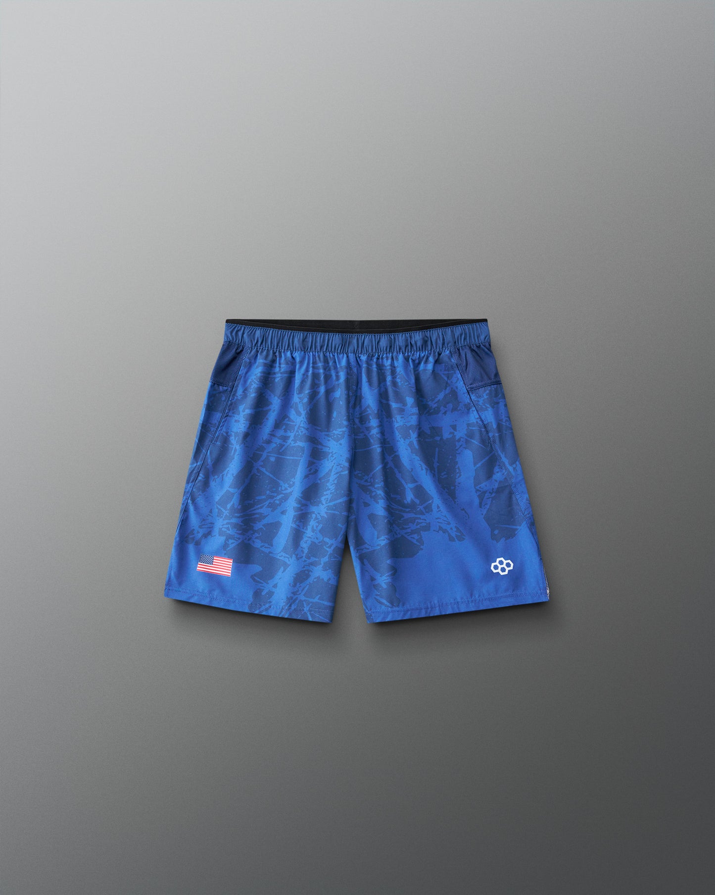 Front view of RUDIS Lacrosse Flag Boys 7" Attack Shorts in navy with tonal graphic print, American flag detail, and RUDIS logo.
