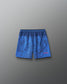 Back view of RUDIS Lacrosse Flag Boys 7" Attack Shorts in navy with tonal graphic print and “Land of the Free, Home of the Brave” detail.