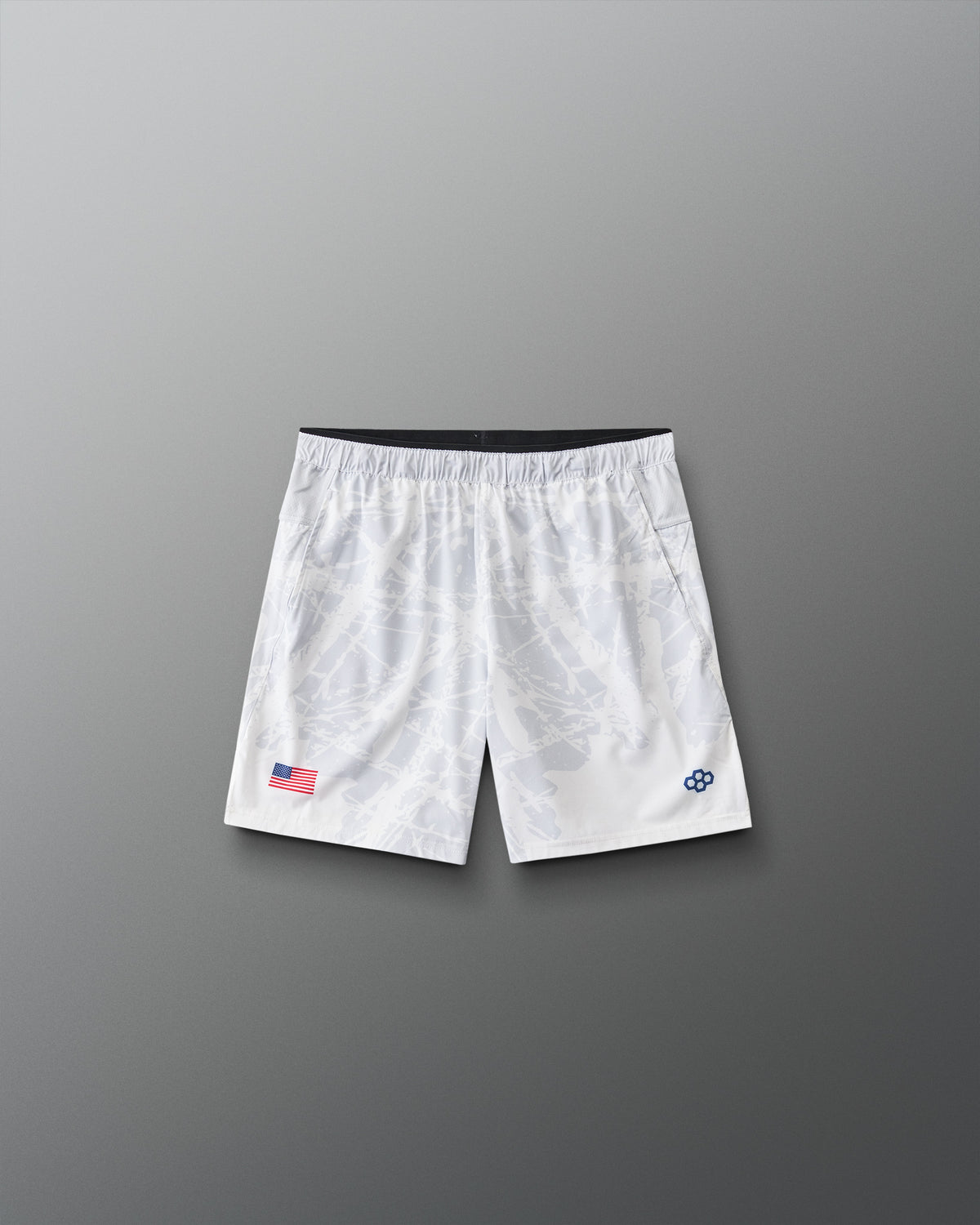 Front view of RUDIS Lacrosse Flag Boys 7" Attack Shorts in white with tonal graphic print, American flag detail, and RUDIS logo.