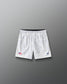 Front view of RUDIS Lacrosse Flag Boys 7" Attack Shorts in white with tonal graphic print, American flag detail, and RUDIS logo.