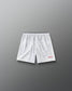 Back view of RUDIS Lacrosse Flag Boys 7" Attack Shorts in white with tonal graphic print and “Land of the Free, Home of the Brave” detail.