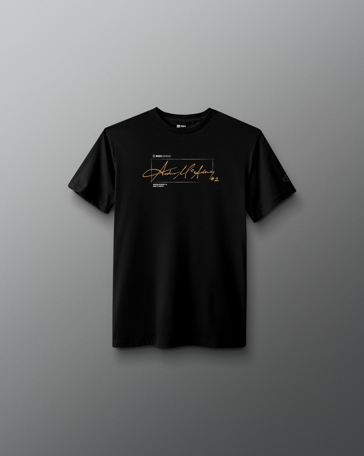 A black short-sleeve crewneck t-shirt with a gold and white graphic print on the chest, displayed against a dark gray gradient background.