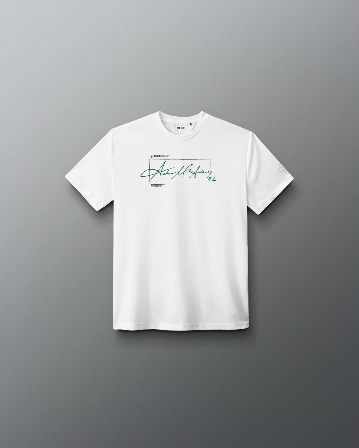 White RUDIS Youth Elite Super Soft T-Shirt featuring Andrew McAdorey's signature in green across the chest with RUDIS Lacrosse branding and #2 graphic.