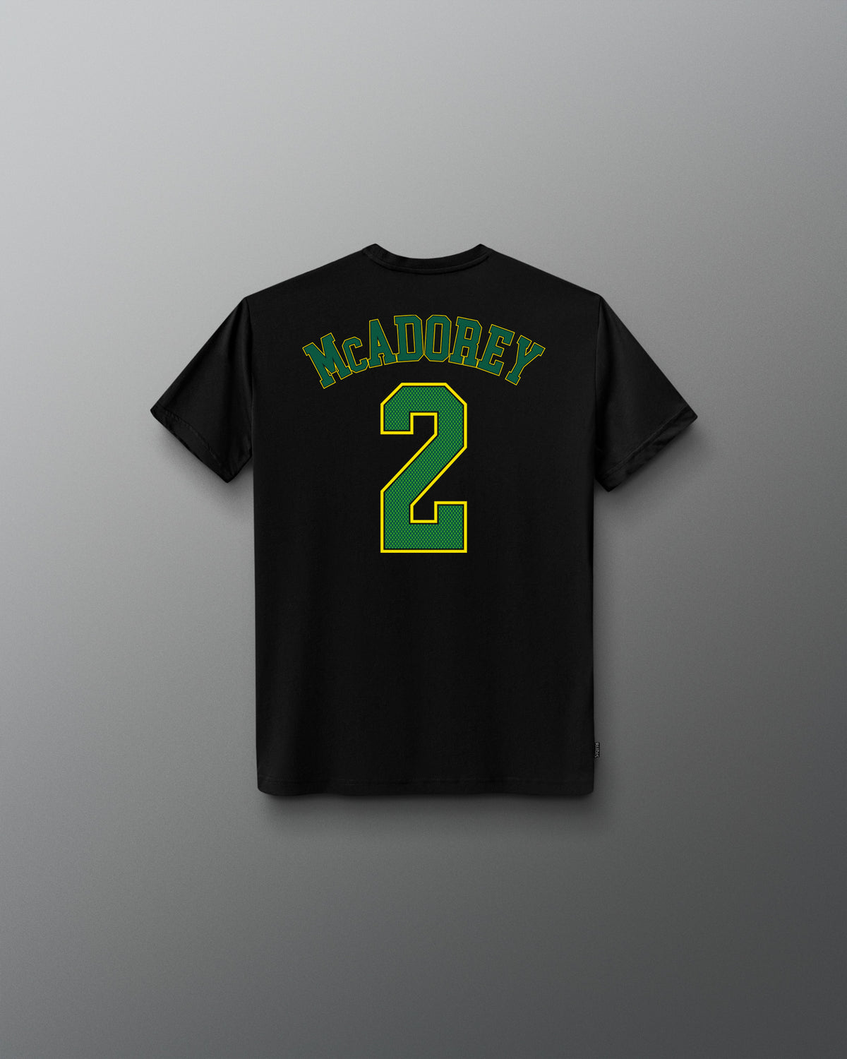 Back view of the black RUDIS McAdorey Jersey Youth Supersoft T-Shirt featuring McADOREY lettering and a large green number 2 graphic.