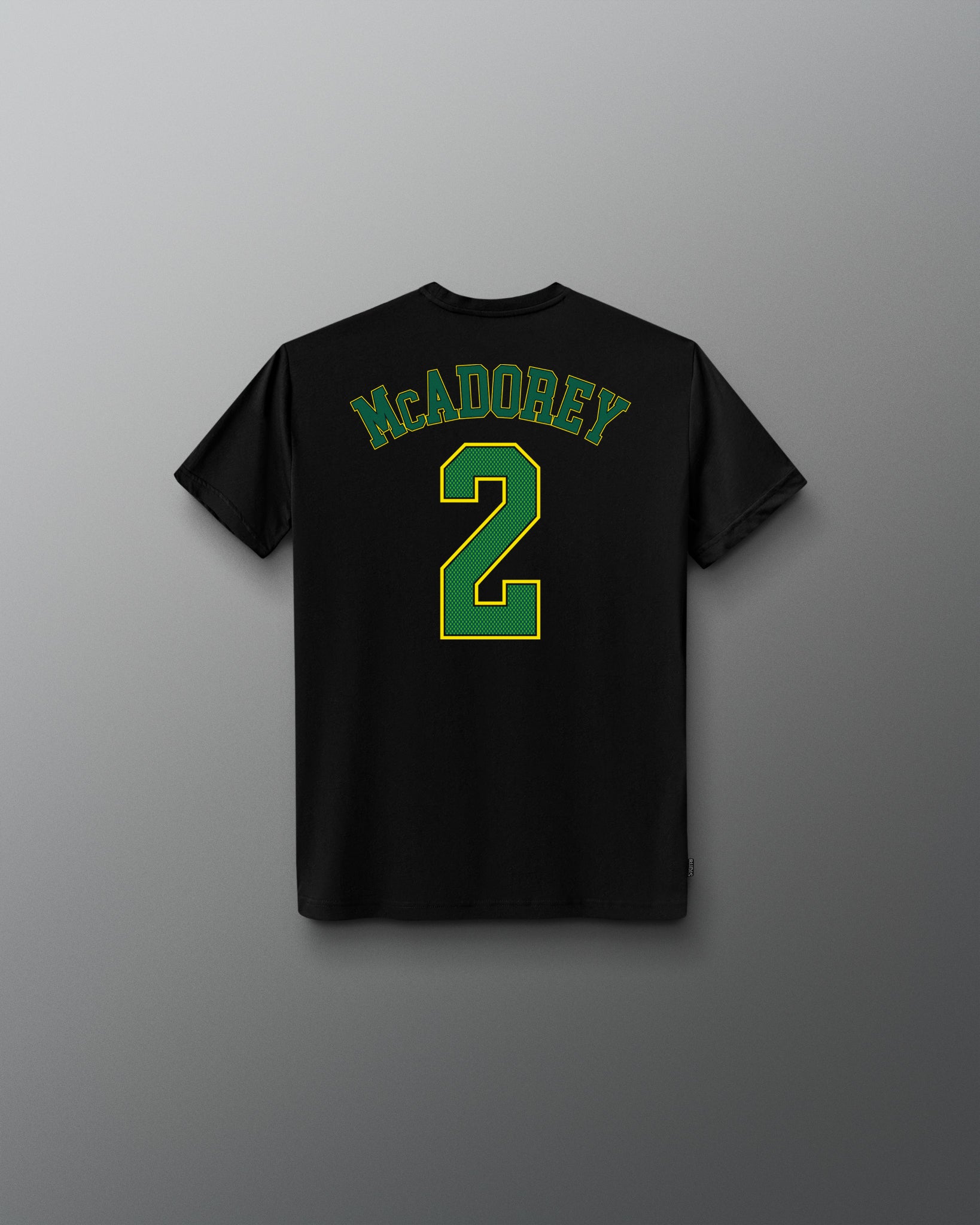Back view of the black RUDIS McAdorey Jersey Youth Supersoft T-Shirt featuring McADOREY lettering and a large green number 2 graphic.