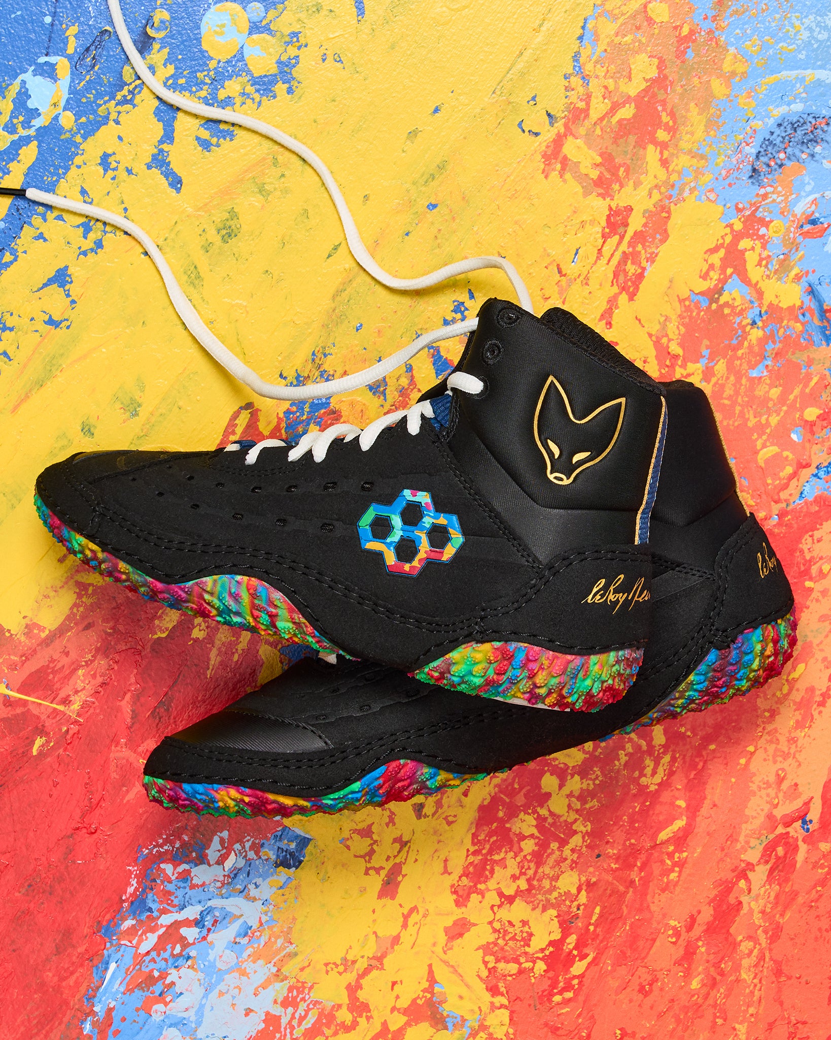 Colorful wrestling shoes with a multicolored sole on a multicolored background