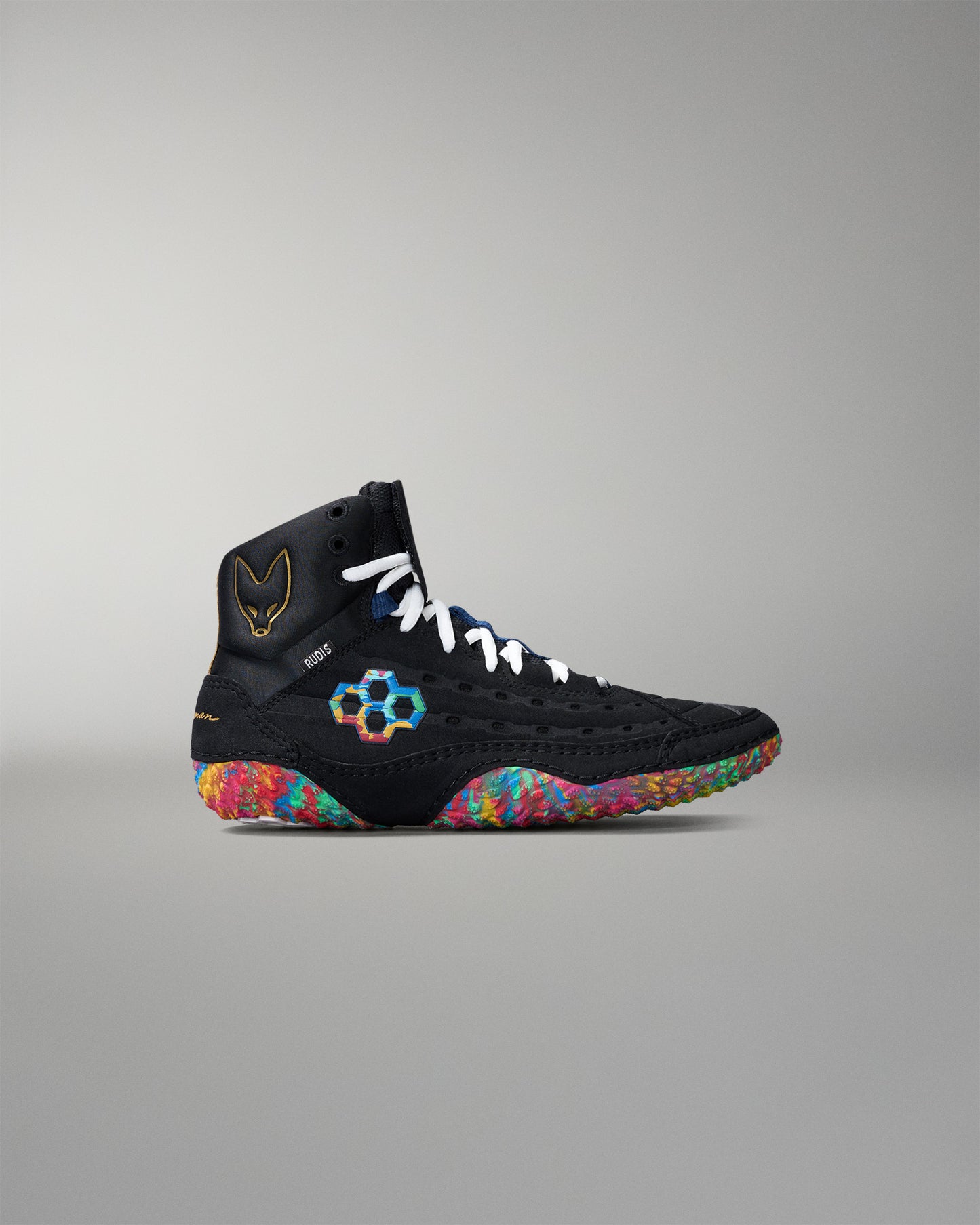 Black wrestling shoe with colorful sole on a gray background