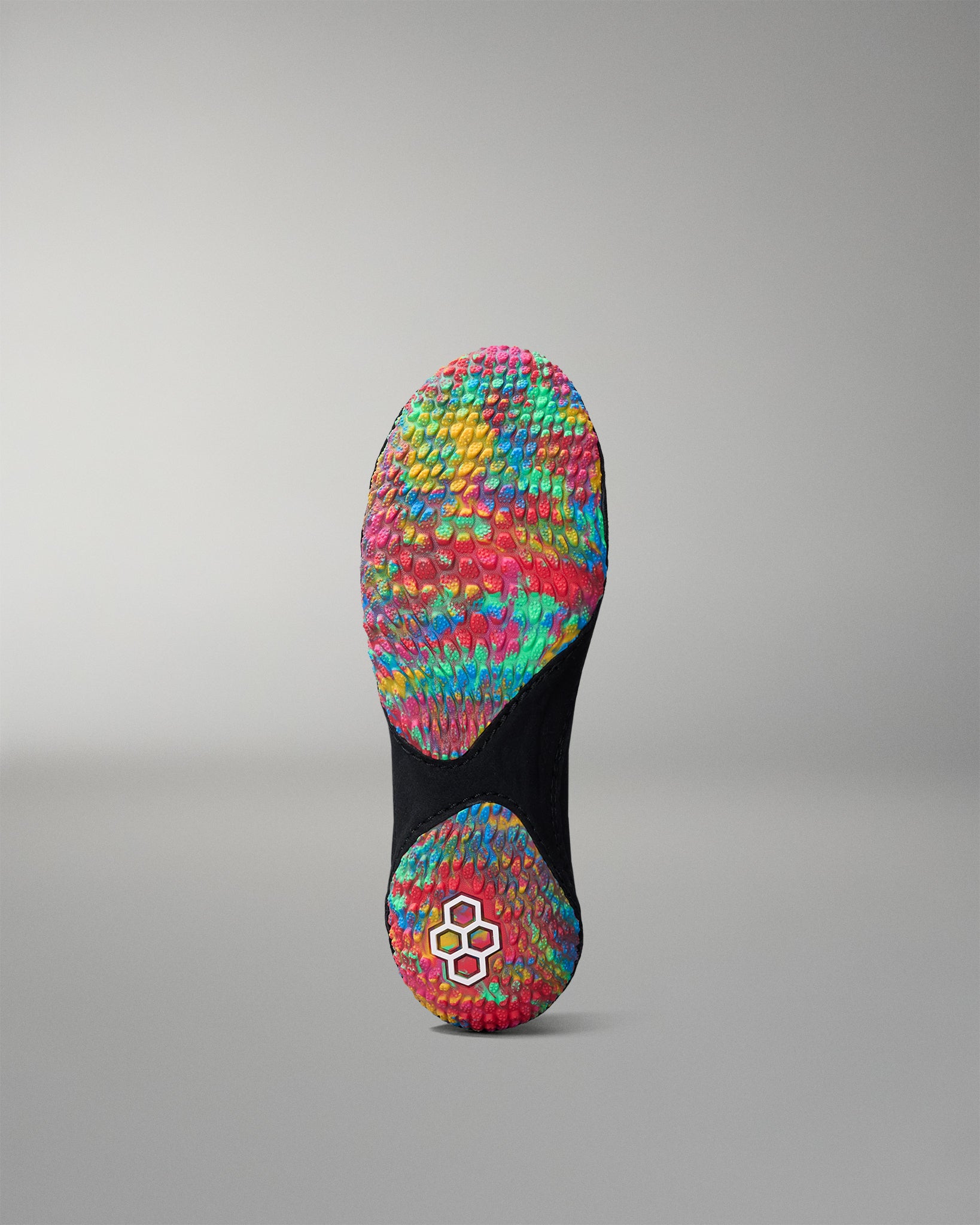 Colorful wrestling shoe sole with a textured pattern on a gray background