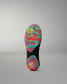 Colorful wrestling shoe sole with a textured pattern on a gray background