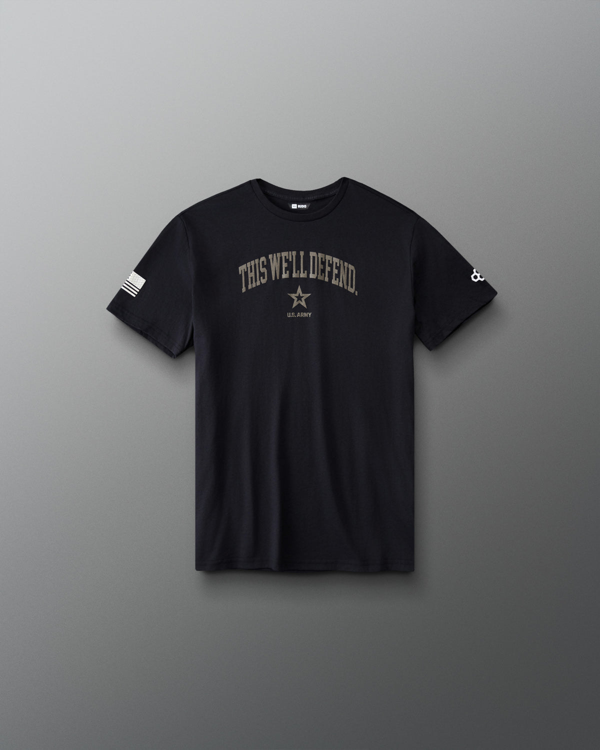 RUDIS U.S. Army Defend Youth Elite Super Soft T-Shirt in Black, front view with THIS WE'LL DEFEND chest graphic, U.S. Army star emblem, and American flag sleeve detail.