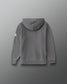 A gray hooded sweatshirt shown from the back, featuring a small white logo on the left sleeve, set against a dark gray gradient background.