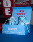 Blue shoe box with wrestling shoes and 'Rocky' branding, featuring a promotional message.