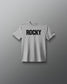 Gray t-shirt with 'ROCKY' text on a gray background