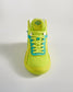 This image showcases a vibrant pair of green and blue athletic shoes with a textured sole designed for comfort and performance