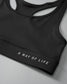 Black sports bra with 'A Way of Life' text on a gray background