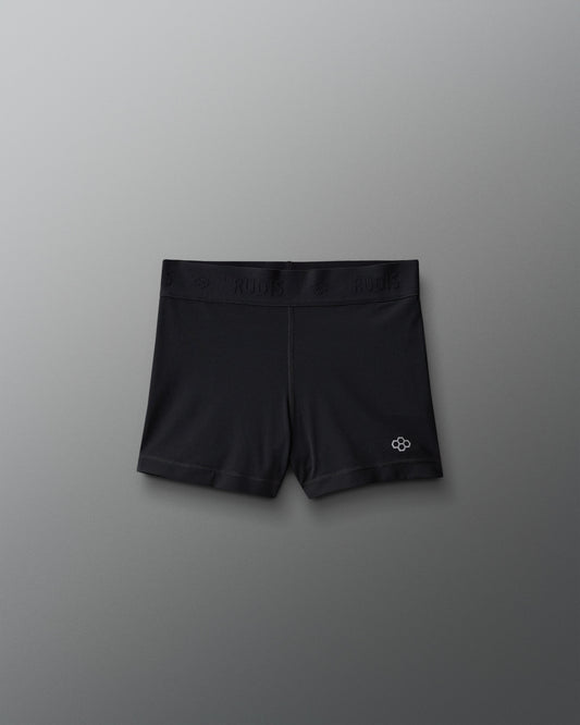 Black athletic shorts with a logo on a gray background