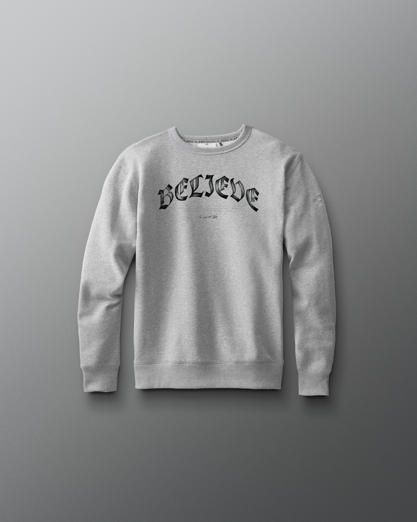 Gray sweatshirt with 'BELIEVE' text on a gray background