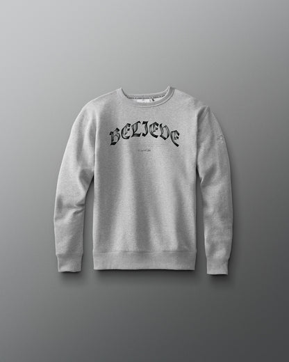 Gray sweatshirt with 'BELIEVE' text on a gray background