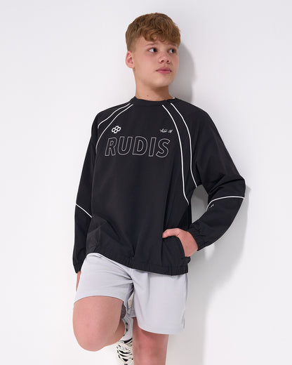 Person wearing a black 'RUDIS' crewneck and white shorts on a white background
