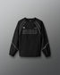 Black long-sleeve athletic shirt with 'RUDIS' branding on a gray background