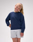 Young girl wearing a navy blue sweatshirt and light gray shorts on a white background