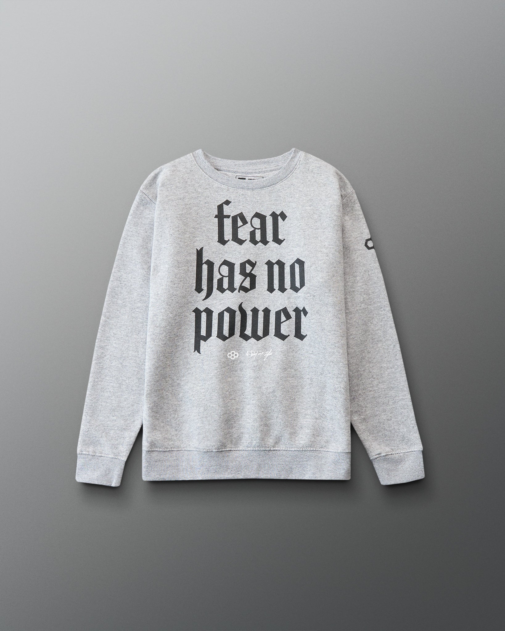 Gray sweatshirt with 'fear has no power' text on a gray background