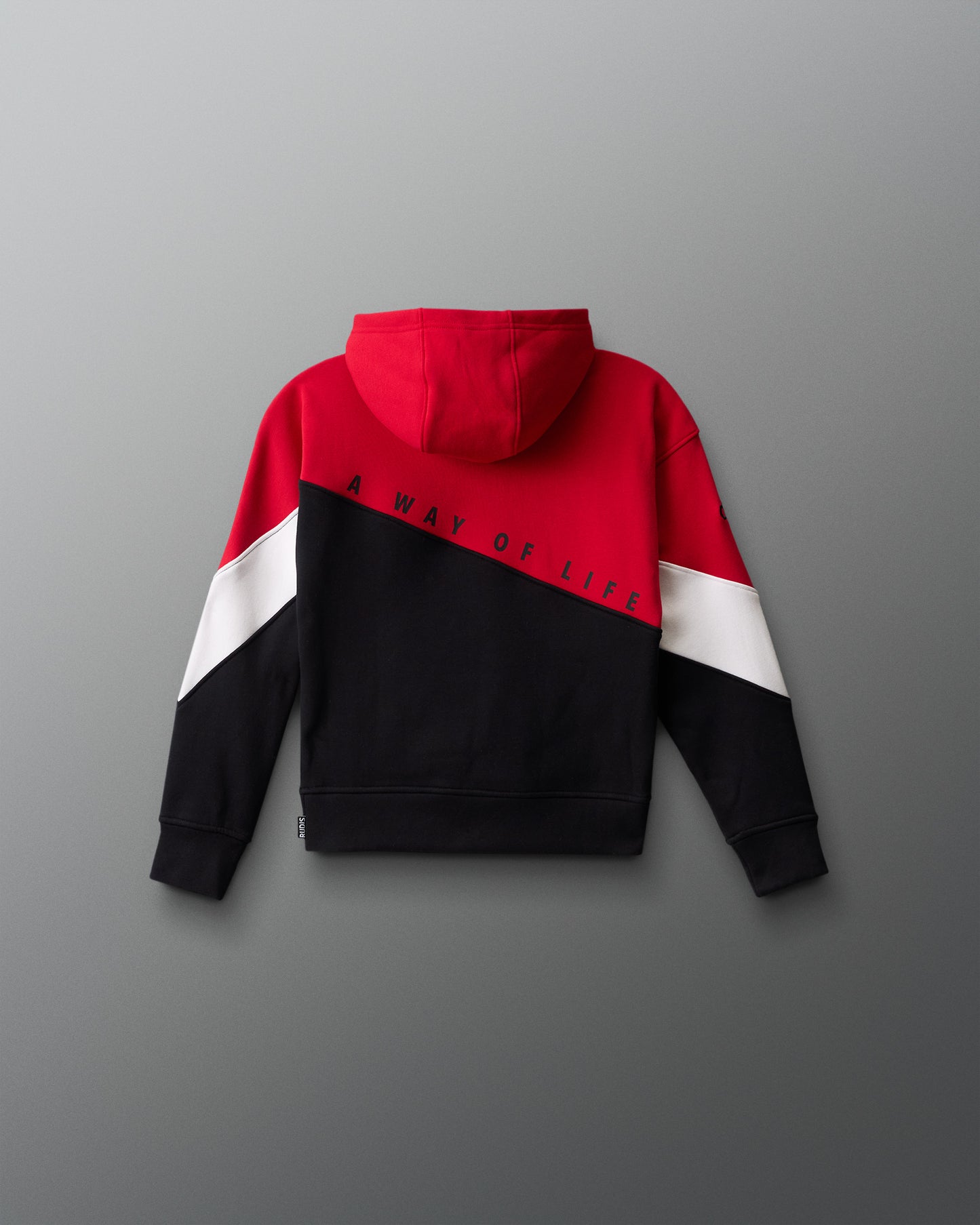 Color-blocked hoodie with red, white, and black design on a gray background