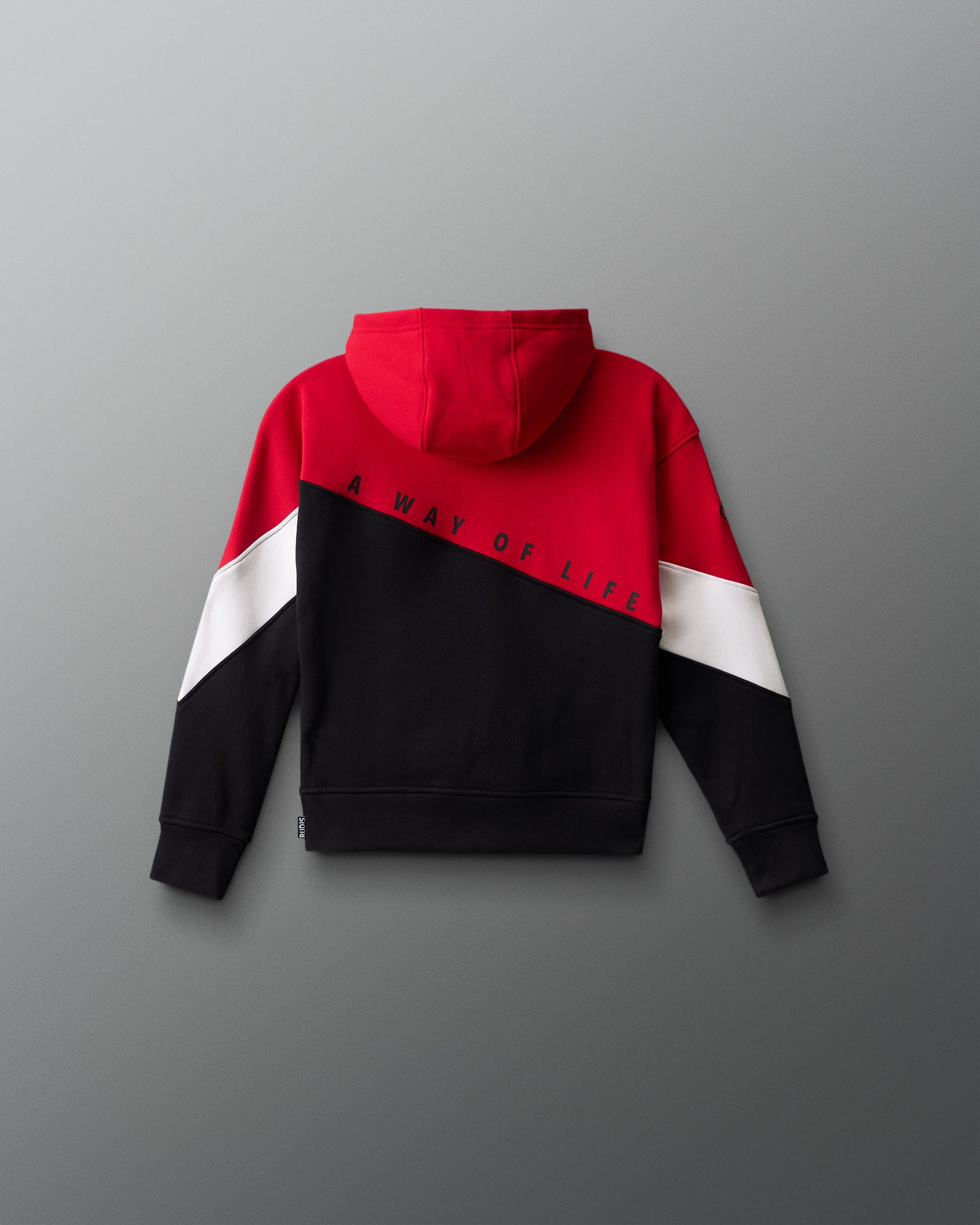 Color-blocked hoodie with red, white, and black design on a gray background