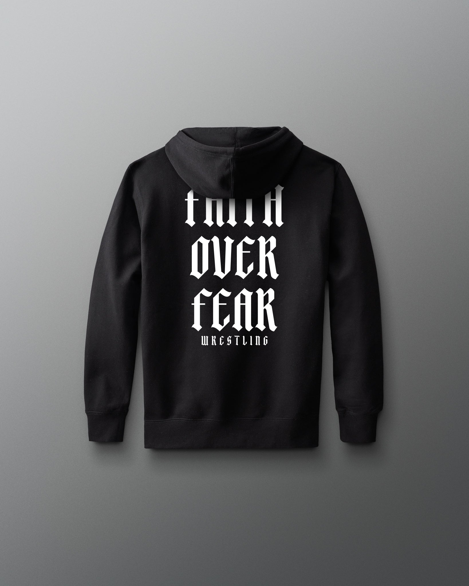 Black hoodie with white text on the back against a gray background