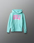Turquoise hoodie with pink text on a gray background