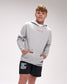 Person wearing a gray hoodie and black shorts with text on a plain background