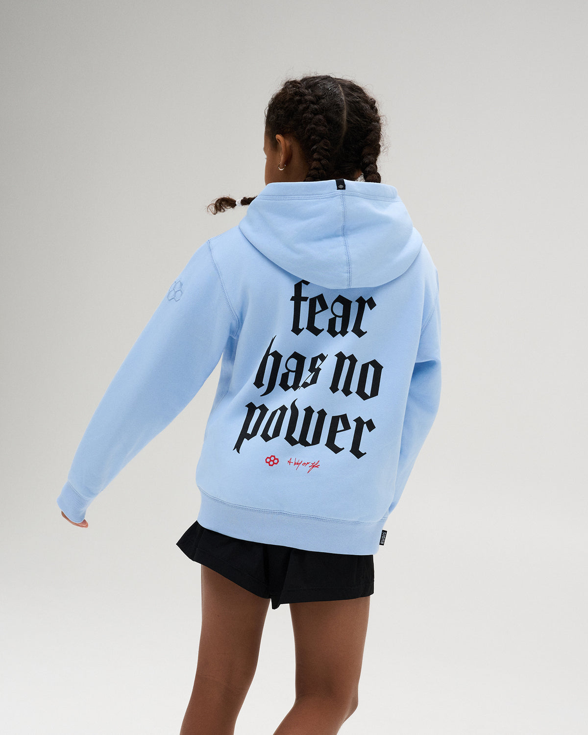 RUDIS Fear Has No Power Youth Comfort Fleece Hoodie in Light Blue, featuring an oversized “Fear Has No Power” back graphic with RUDIS A Way of Life branding.