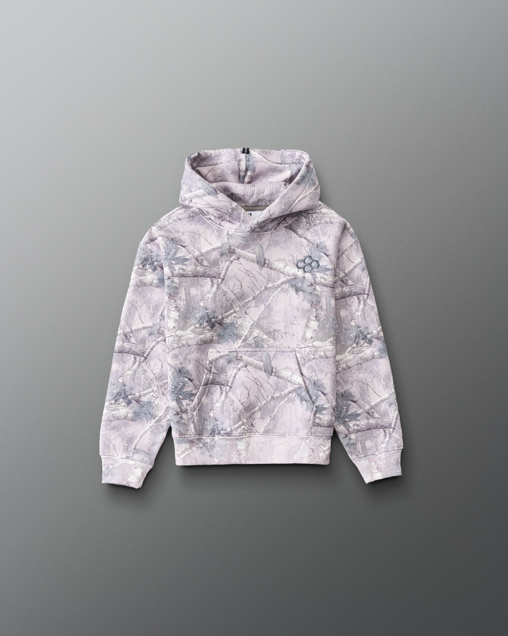 RUDIS Essential Hex Youth Relaxed Comfort Fleece Hoodie in Tree Camo, front view featuring woodland camouflage, Hex chest logo, and kangaroo pocket. Copy Alt Text