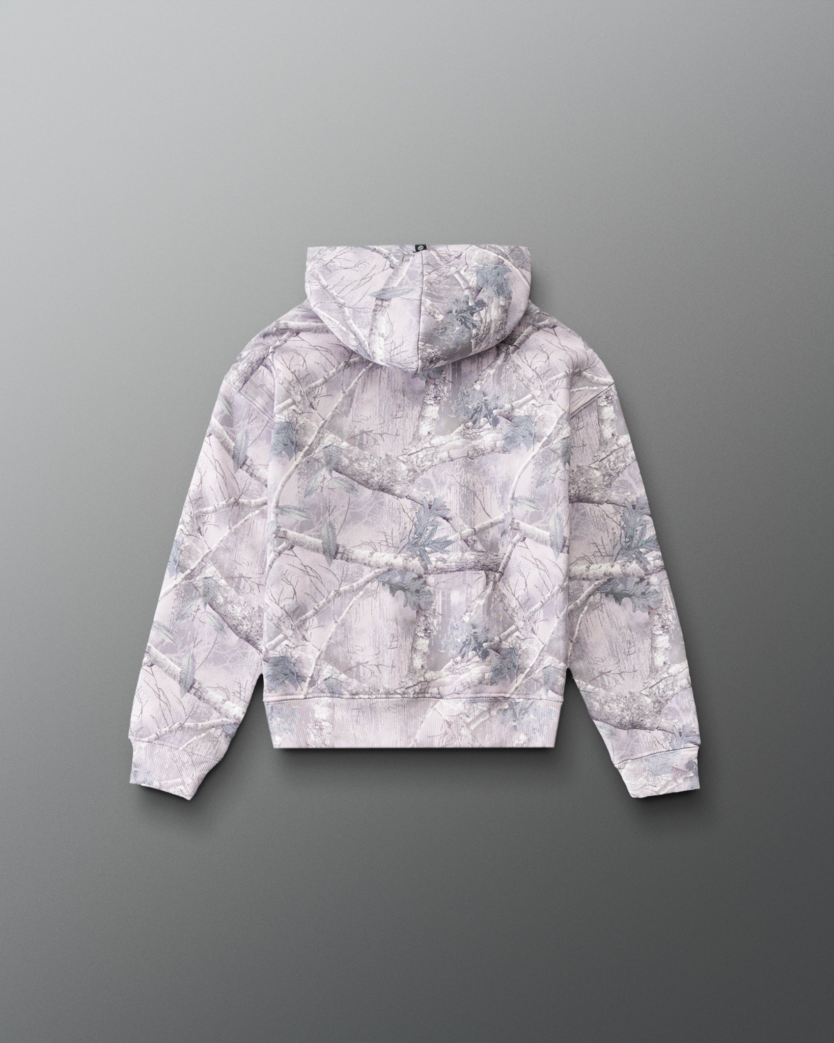RUDIS Essential Hex Youth Relaxed Comfort Fleece Hoodie in Tree Camo, back view showing the allover tree camouflage pattern, hood, and ribbed cuffs. Copy Alt Text