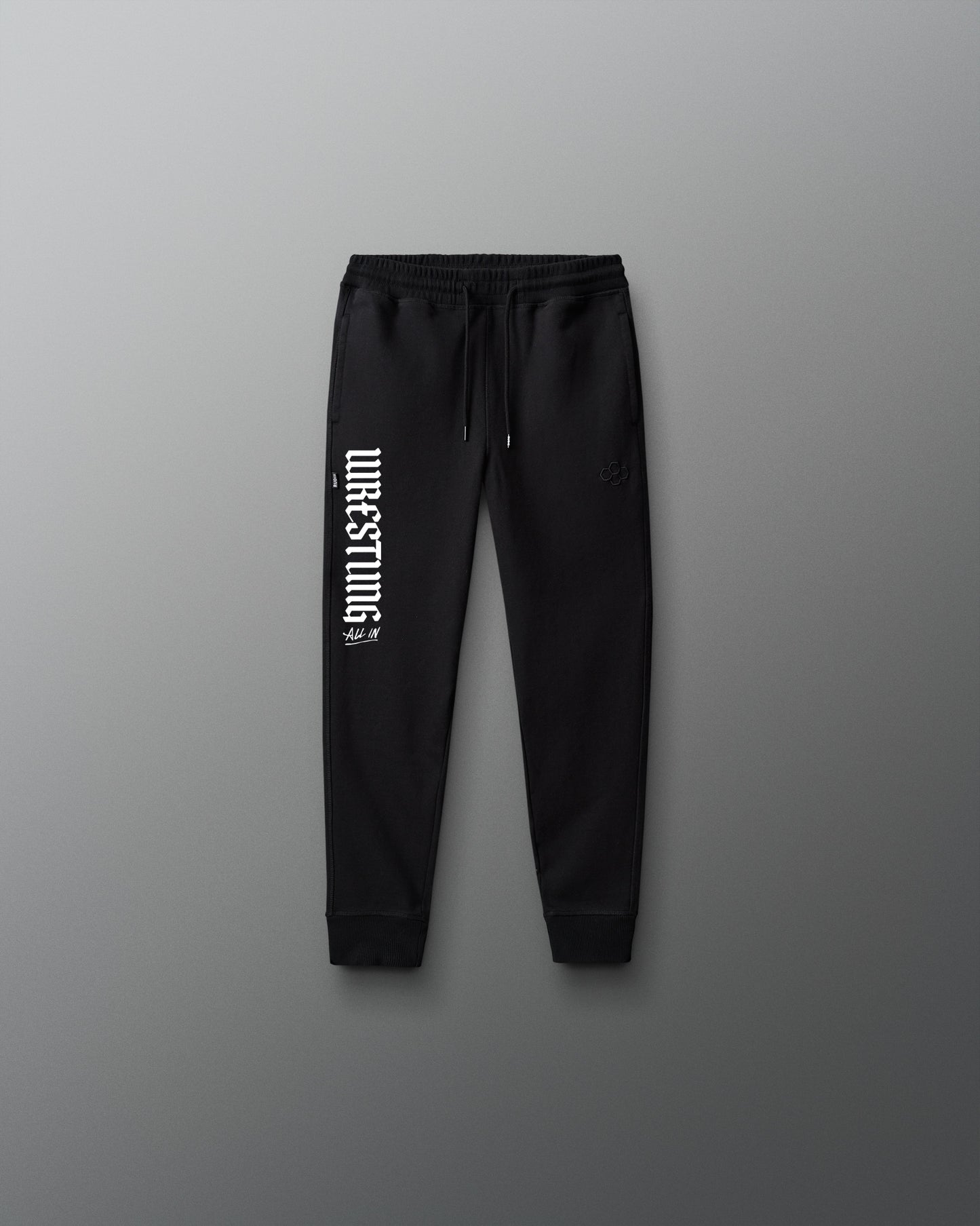 Black sweatpants with white text on a gray background