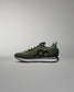 Green sneaker on a gray background