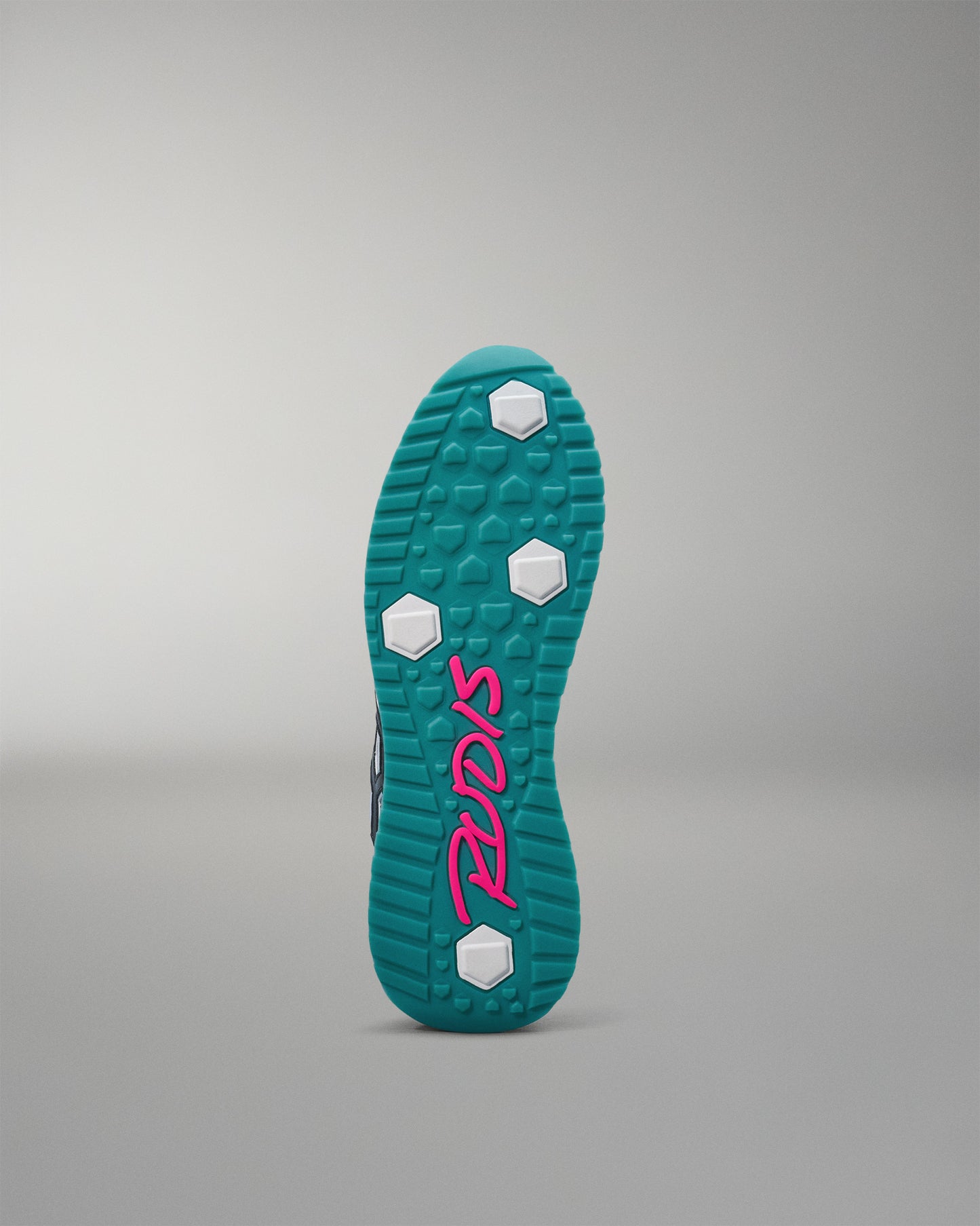 Teal shoe sole with pink logo on a gray background