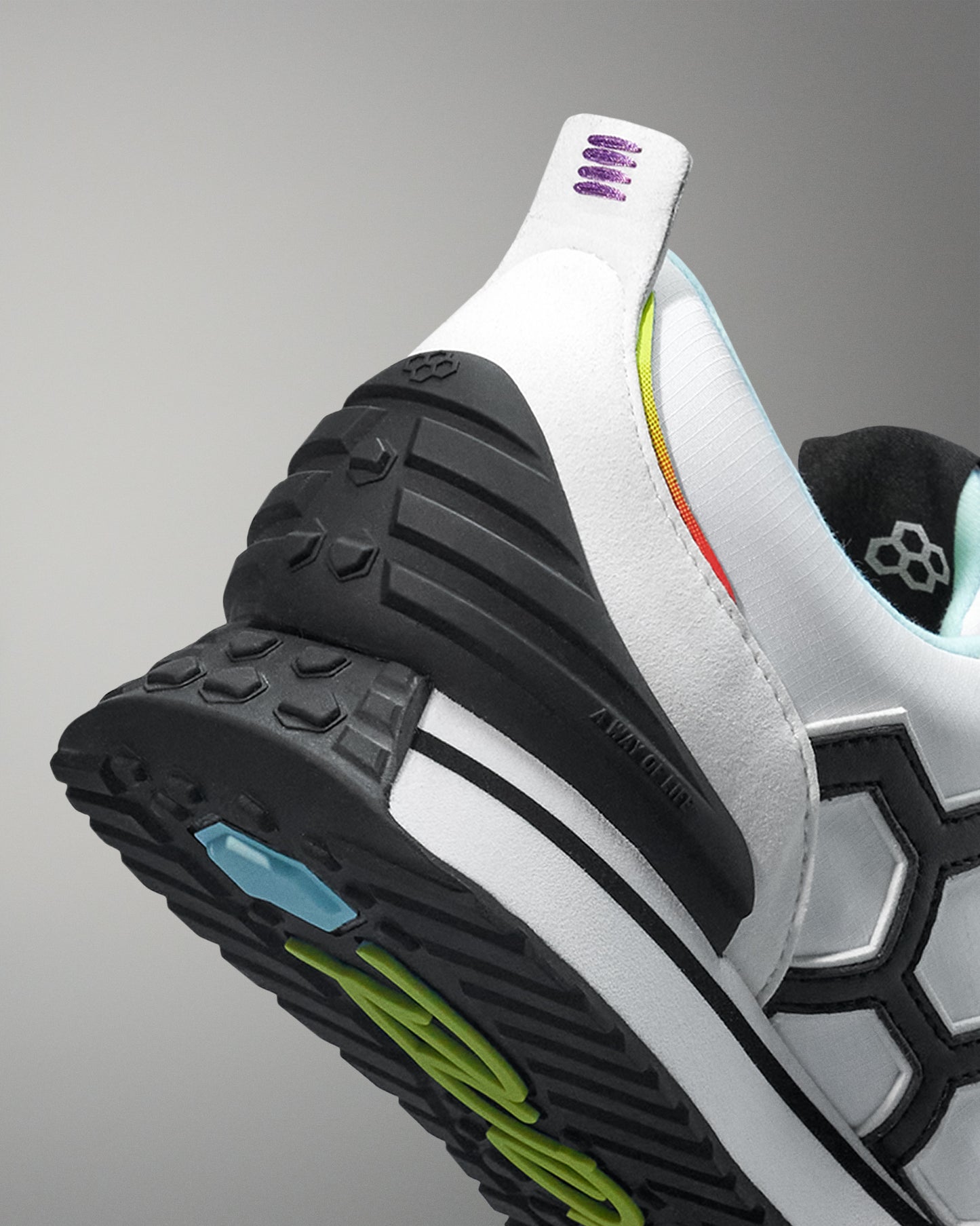 Close-up of a sports shoe with a focus on the sole and brand logo.