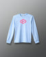 Light blue long-sleeve shirt with a pink geometric logo on a gray background