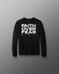Black long-sleeve shirt with 'Faith Over Fear' text on a gray background
