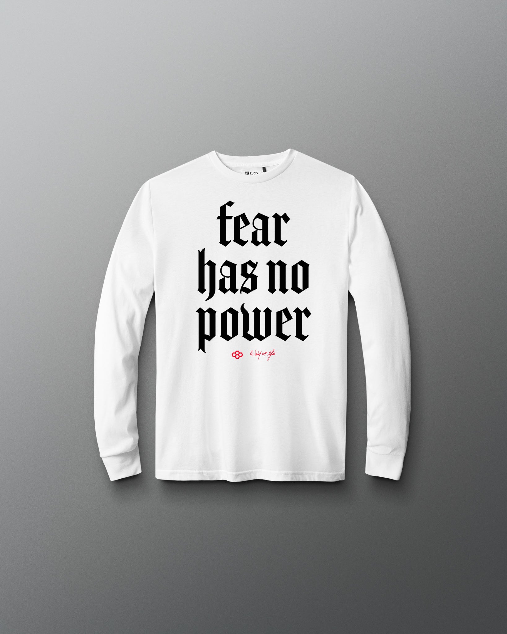 White long-sleeve shirt with 'fear has no power' text on a gray background