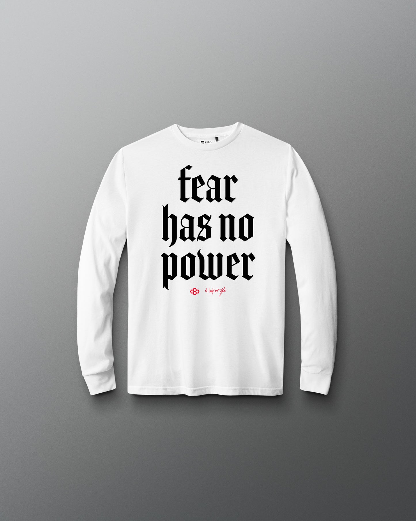 White long-sleeve shirt with 'fear has no power' text on a gray background