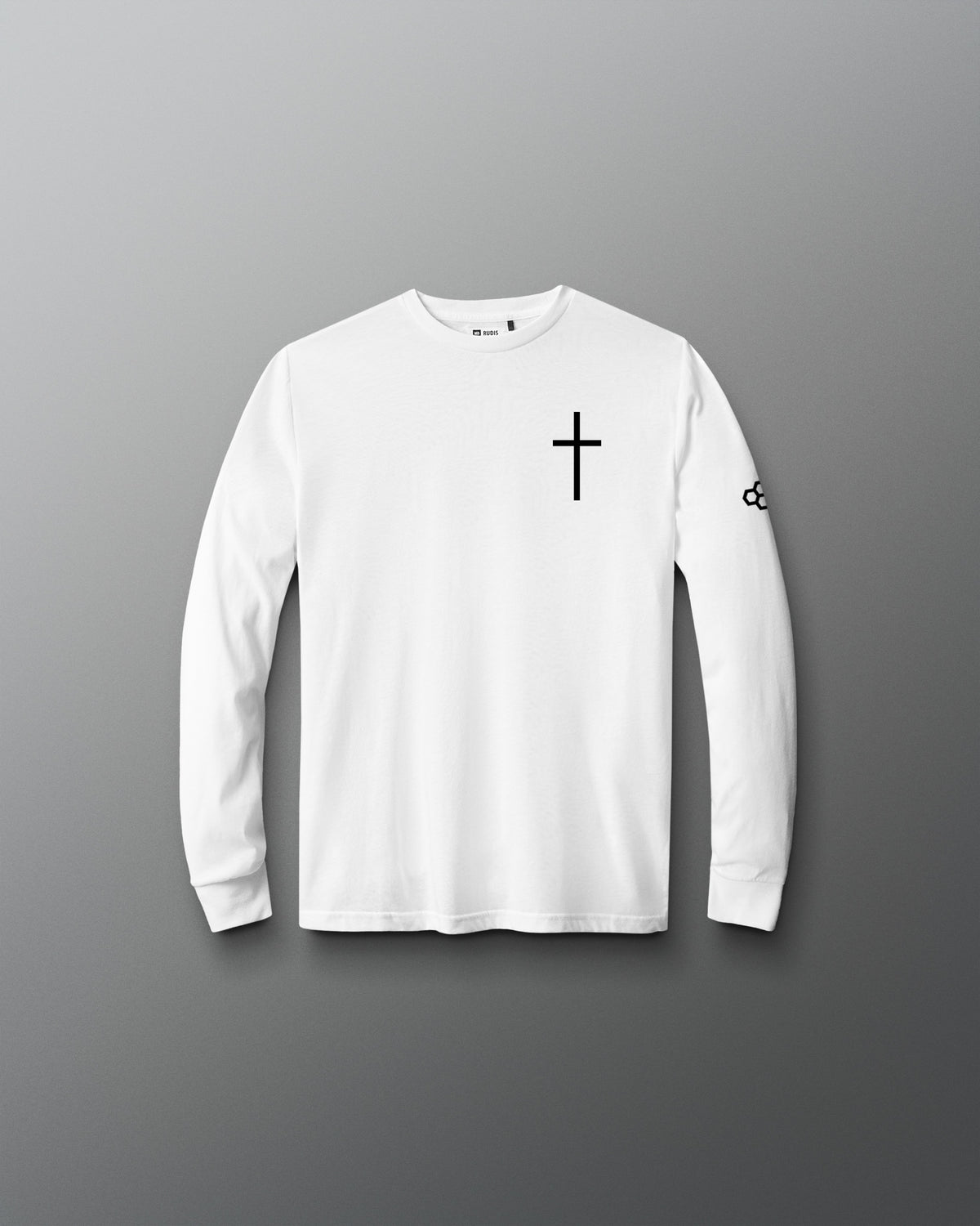 A white long-sleeve crewneck shirt with a black cross printed on the left chest and a small black logo on the right sleeve, displayed against a dark gray gradient background.
