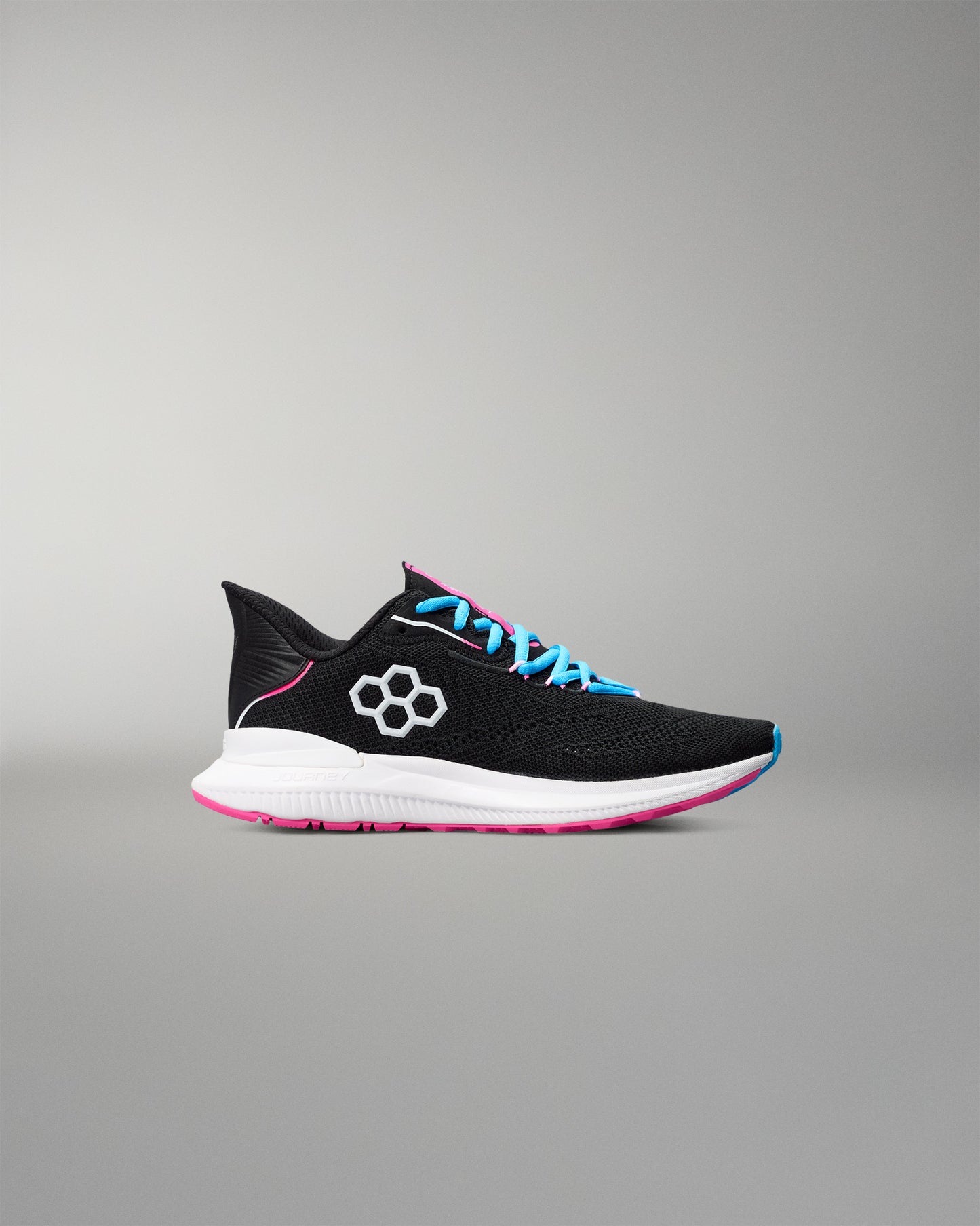 Black running shoe with colorful laces on a gray background