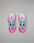 Pink running shoes with black and blue accents on a gray background