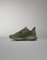 Green training shoe on a gray background