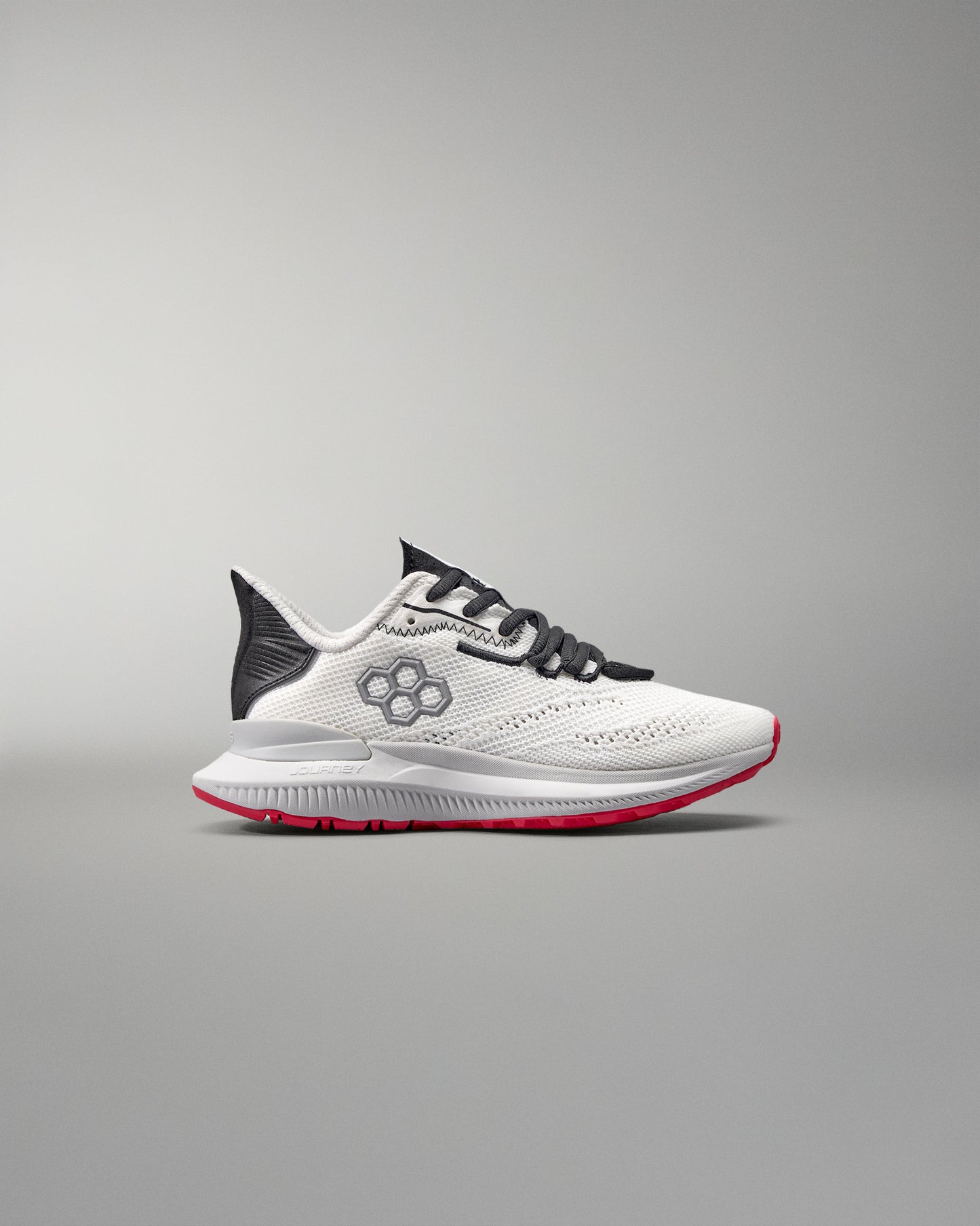 White running shoe with black and red accents on a gray background