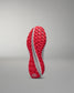 Red training shoe sole on a gray background